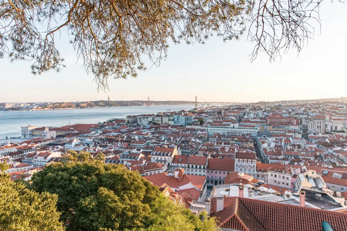 Lisbon's red rooftops, the Tagus and the 25 de Abril bridge