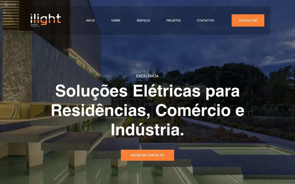 ILIGHT homepage with a modern house lit at dusk and the headline "Soluções Elétricas para Residências, Comércio e Indústria"