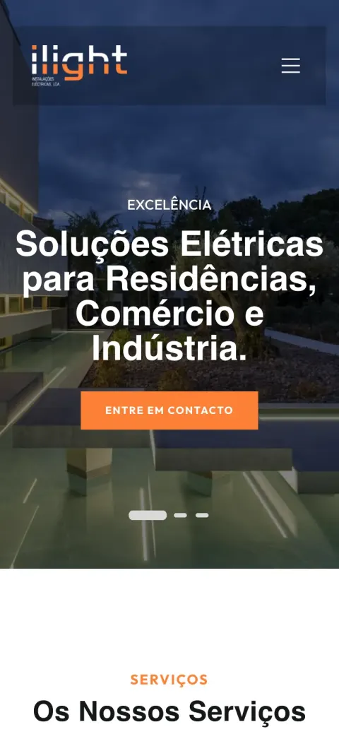 ILIGHT homepage with a modern house lit at dusk and the headline "Soluções Elétricas para Residências, Comércio e Indústria" (mobile)